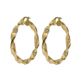 Nahaufnahme der gedrehten Versage Muster Ohrringe aus 14 Karat Gold
