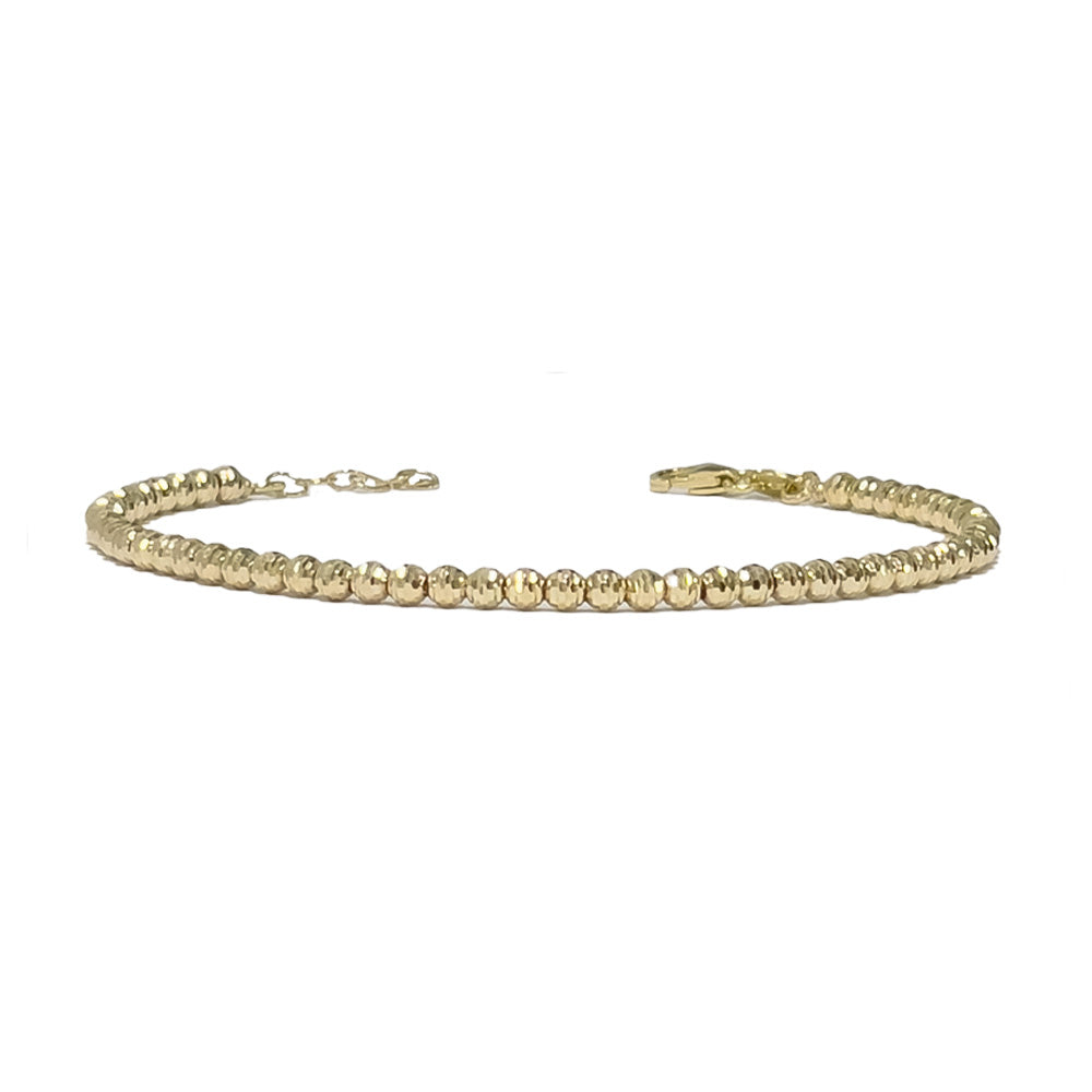 Goldenes Armband mit geschliffenen Goldkugeln. Luxuriöses Accessoire für stillvolle Eleganz