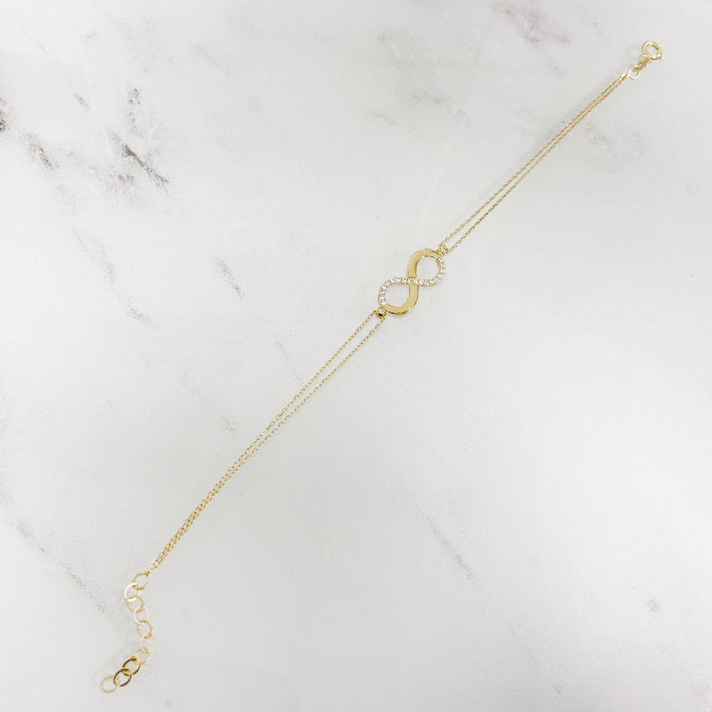 Damen-Armkette,585/14Karat Gold, Unendlichkeitmotiv mit Zirkonia, Federverschluss. Verstellbare Grösse für zeitlose Eleganz! liegend
