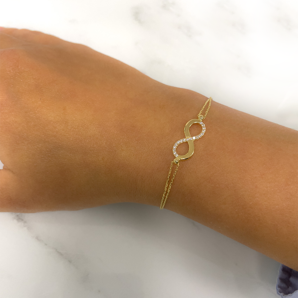 Damen-Armkette,585/14Karat Gold, Unendlichkeitmotiv mit Zirkonia, Federverschluss. Verstellbare Grösse für zeitlose Eleganz! Traumbild