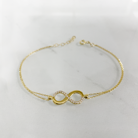 Damen-Armkette,585/14Karat Gold, Unendlichkeitmotiv mit Zirkonia, Federverschluss. Verstellbare Grösse für zeitlose Eleganz! Frontbild